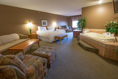 Wide Angle of King Suite with Hot Tub at Prime Hotel Fort McMurray